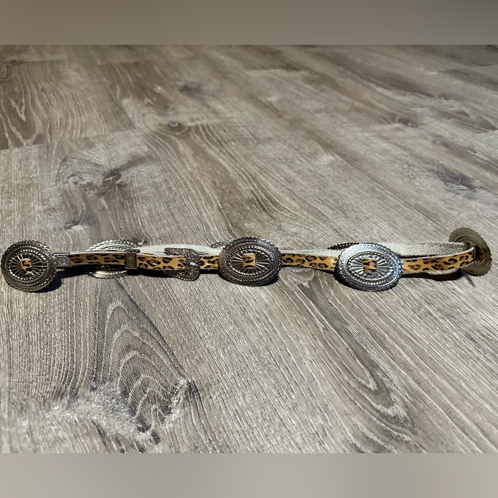 Faux leather (cheetah) with metal pieces and buckle